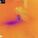 Infrared camera scan of a residential wall highlighting blue color gradients that indicate moisture leak.
